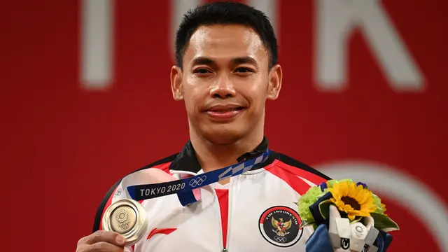 Foto: Eko Yuli Irawan Persembahkan Medali Kedua bagi Indonesia Setelah Sabet Perak di Cabang Olahraga Angkat Besi Olimpiade Tokyo 2020