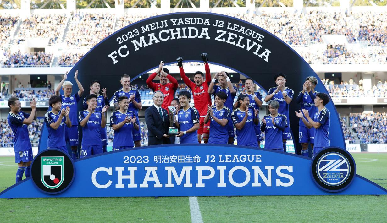 Dari J2 League, Machida Zelvia berhasil jadi juara dengan mengumpulkan 87 poin dari 42 laga sepanjang musim. Zelvia berhasil promosi ke kasta teratas untuk kali pertama sepanjang sejarah klub sejak berdiri pada 1989 dan sejak masuk ke J.League pada 2012 lalu. (Dokumentasi J.League)