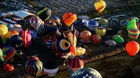 Balon udara beragam bentuk terbang di atas kota selama Festival Balon Udara Internasional ke-21 di Leon, negara bagian Guanajuato, Meksiko, 18 November 2023. (ULISES RUIZ/AFP)