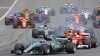 Pebalap Mercedes, Valtteri Bottas, berada di poisisi pertama F1 GP Austria di Sirkuit Red Bull Ring, Minggu (9/7/2017). Valtteri Bottas menjadi yang tercepat dengan catatan waktu 1 jam 21 menit 48,527 detik. (AFP/Joe Klamar)