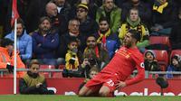 Gaya selebrasi pemain Liverpool, Emre Can yang mecetak satu gol bagi timnya ketika bersua  Watford  pada laga Premier League pekan ke-11 di Anfield, Liverpool. (AFP/Paul Ellis)