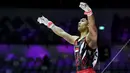 <p>Pesenam putra Indonesia, Satria Tri Wira Yudha melakukan selebrasi setelah beraksi pada nomor palang tunggal dalam Kejuaraan Dunia Gimnastik 2025 di Indonesia Arena, Senayan, Jakarta, Senin (20/10/2025). (Bola.com/Bagaskara Lazuardi)</p>