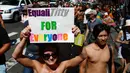 Seorang wanita saat menggelar GoTopless Parade di New York (28/8). Aksi ini menyerukan kesetaraan gender baik perempuan dan pria dalam telanjang dada. (AFP PHOTO / KENA Betancur)