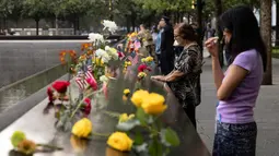 Tragedi 11 September 2001 menjadi serangan teroris terbesar yang mengguncang AS dalam sejarah. (AP Photo/Yuki Iwamura)