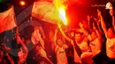 Euforia fans klub Real Madrid menyambut kedatangan Trofi Liga Champions di Jakarta.(Liputan6.com/Helmi Fitriyansyah)