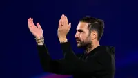 Pelatih Como asal Spanyol, Cesc Fabregas, merayakan kemenangan dalam pertandingan Liga Champions UEFA—pekan ketiga fase liga—antara Como 1907 dan Manchester United di Stadio Giuseppe Sinigaglia, Como, Italia bagian utara, pada 21 Oktober 2026. (Marco BERTORELLO/AFP)