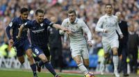 Meski menang lawan Sevilla, Real Madrid sempat dicemooh suporternya. (AP Photo/Francesco Seco)