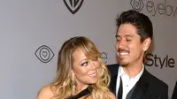 Penyanyi Mariah Carey dan kekasihnya, Bryan Tanaka menghadiri acara after party Golden Globes di California, Minggu (7/1). Kemesraan Mariah Carey dan pacar brondongnya tak pelak menjadi pemandangan yang sayang dilewatkan (Frazer Harrison/GETTY IMAGES/AFP)