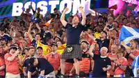 Suporter Skotlandia merayakan kemenangan usai pertandingan Grup C Piala Dunia antara Haiti dan Skotlandia di Foxborough, Massachusetts, dekat Boston, Sabtu, 13 Juni 2026. (AP Photo/Charlie Krupa)