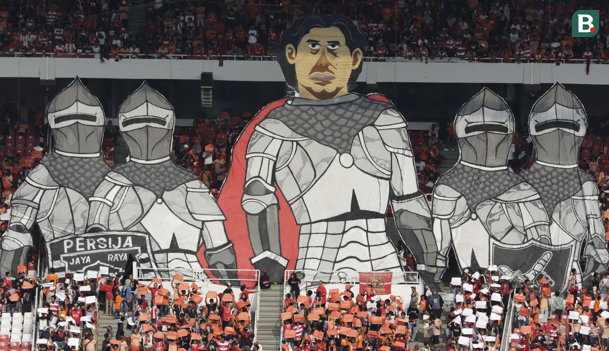 Suporter Persija, The Jakmania, menampilkan koreografi pelatih Stefano Teco saat melawan Persela pada laga Liga 1 di SUGBK, Jakarta, Selasa (20/11). Persija menang 3-0 atas Persela. (Bola.com/Vitalis Yogi Trisna)