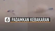 Sebuah aksi keren dipertonton pengemudi mobil saat membantu memadamkan api mobil yang terbakar di padang pasir.