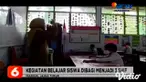 Nampak terlihat di SDN 1 Kare, Kabupaten Madiun, Jawa Timur, para murid mulai kembali belajar tatap muka, di sekolah dengan menerapkan protokol kesehatan pada Senin pagi (14/12).