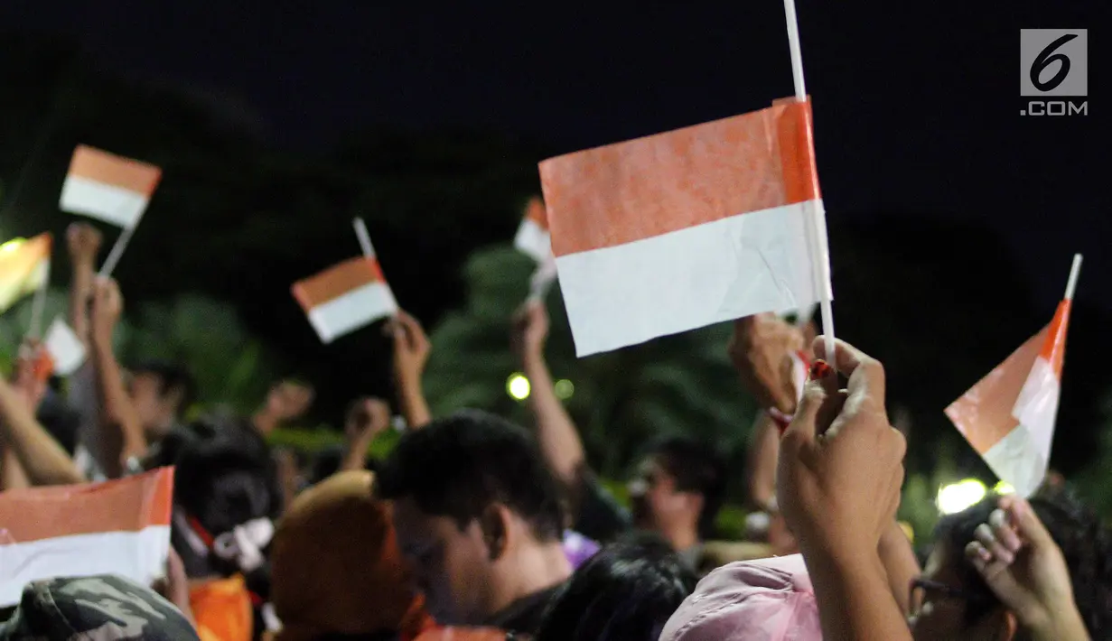 Masyarakat yang tergabung dalam Silent Majority Forum melakukan aksi damai di Silang Monas, Jakarta, Kamis (1/6). Mereka menentang segala bentuk perbedaan keadilan oleh kelompok tertentu. (Liputan6/JohanTallo)