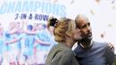Seorang suporter Manchester City mencium papan bergambar Pep Guardiola saat merayakan gelar juara Liga Inggris di depan Stadion Etihad, Sabtu (20/5/2023). City memastikan gelar juara setelah Arsenal dikalahkan Nottingham Forest dengan skor 0-1 pada lanjutan Liga Inggris 2022/2023 hari Minggu (21/05/2023). (Martin Rickett/PA via AP)