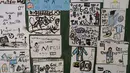 Gambar Lionel Messi dan tim Argentina, yang dibuat oleh siswa di sekolah dasar General Las Heras tempat Messi juga bersekolah, dipamerkan di dinding sekolah di Rosario, Rabu (14/12/2022). Rosario, k jauh lebih dikenal sebagai kota penghasil pemain sepak bola bertalenta besar, termasuk Lionel Messi. (AP Photo/Rodrigo Abd)