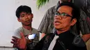 Ali Syamiarta menjawab pertanyaan wartawan usai melaporkan Agus Gumiwang ke Bareskrim Mabes Polri, Jakarta, Senin (30/3/2015). Ali melaporkan Agus Gumiwang karena dianggap telah memalsukan dokumen milik Partai Golkar.(Liputan6.com/Yoppy Renato)