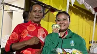 Varadisa Septi Putri, atlet gulat putri Jawa Timur (Jatim), menyabet Medali Emas di PON XXI Aceh-Sumut 2024 (Reza Efendi/Liputan6.com)