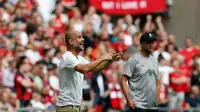 Manajer Manchester City, Pep Guardiola, mengaku puas dengan pertandingan kontra Liverpool pada laga Community Shield 2019, di Stadion Wembley, Minggu (4/8/2019). (AFP/Ian Kington)