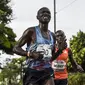Pelari Kenya, Joseph Kiprono ditabrak mobil saat mengikuti lomba di Kolombia (Joaquin SARMIENTO / AFP)