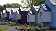 Desain rumah ala NestHouse pada peluncuran proyek Social Bite Village di Granton, Edinburgh di Skotlandia, 17 Mei 2018. Social Bite berencana membangun 10 rumah dengan biaya rendah dan lingkungan yang aman bagi 20 orang tunawisma. (AFP/Andy Buchanan)