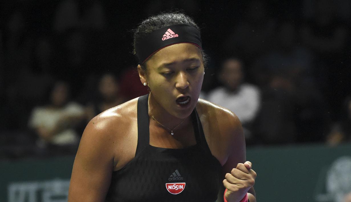 Di final Naomi mengalahkan Serena Williams dengan straight set. Hal tersebut menjadikan Naomi Osaka sebagai petenis wanita yang paling dicari di halaman google pada tahun 2018. (AFP/Roslan Rahman)