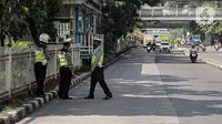 Polisi lalu lintas berkumpul saat Operasi Zebra Jaya 2022 di Jakarta, Selasa (4/10/2022). Operasi Zebra Jaya dilaksanakan pada tanggal 3 hingga 17 Oktober untuk menekan jumlah pelanggaran lalu lintas. (Liputan6.com/Faizal Fanani)