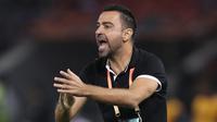 Mantan bintang Barcelona yang kini melatih klub Qatar Al Sadd diisukan akan menangani Barcelona musim depan menggantikan Ronald Koeman seiring habisnya kontrak di Al-Sadd pada 30 Juni ini. Sumber tepercaya menyebut, Xavi segera memperpanjang kontraknya hingga 2023. (AFP/Karim Jaafar)