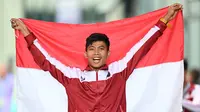 Atlet Indonesia, Saptoyogo Purnomo, merebut medali emas pertama untuk Tim Merah Putih di Asian Para Games 2022 melalui nomor atletik, di Huanglong Sports Center Stadium, Senin (23/10/2022). (Bola.com/NPC Indonesia)