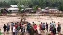 Kondisi pemukiman di Lanao del Norte yang disapu oleh banjir dahsyat, Filipina selatan (22/12). Sebuah badai tropis telah menimbulkan banjir bandang serta memicu longsor di Filipina selatan sehingga puluhan orang tewas. (Aclimah Disumala via AP)