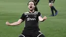 Periode tanpa gelar dirasakan selama empat tahun Daley Blind bersama Manchester. Daley Blind pun kembali pulang ke Ajax Amsterdam dan mengantarkan timnya merebut gelar juara di musim 2018/2019 dan 2020/2021. (AFP/Marco Bertorello)