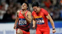 Pelari Indonesia, Lalu Muhammad Zohri, saat berlaga pada nomor 100 meter Asian Games di SUGBK, Jakarta, Minggu (26/8/2018). Lalu Zohri finish diurutan ke tujuh dengan catatan waktu 10,20 detik. (Bola.com/Peksi Cahyo)