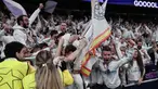 Penyerang Real Madrid, Brahim Diaz melompat ke tribun penonton setelah mencetak gol kedua bagi timnya pada pertandingan leg pertama 16 besar Liga Champions 2024/2025 melawan Atletico de Madrid di stadion Santiago Bernabeu, Madrid, pada 4 Maret 2025 waktu setempat atau Rabu (5/3/2025) dini hari WIB. (Thomas COEX/AFP)