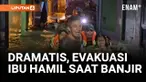 Seorang ibu hamil dievakuasi dengan ban pelampung dari rumahnya yang terendam banjir setinggi dua meter di Kebon Pala, Jatinegara, Minggu malam. Petugas gabungan Satpol PP, TNI, dan Polri bergerak cepat membawa korban ke rumah sakit.