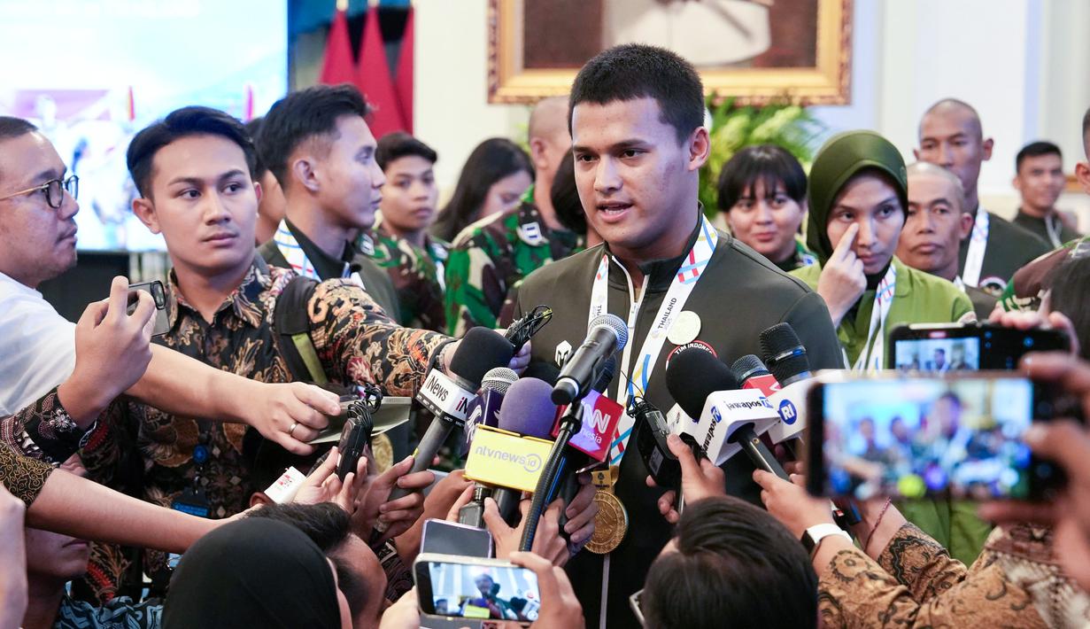 Rizki membuat angkatan seberat 205 kilogram clean and jerk yang menjadi rekor dunia baru dari 204 kilogram. Ia juga memecahkan rekor dunia (363 kilogram) untuk angkatan total. (Foto: Muchlis Jr - BPMI Sekretariat Presiden)