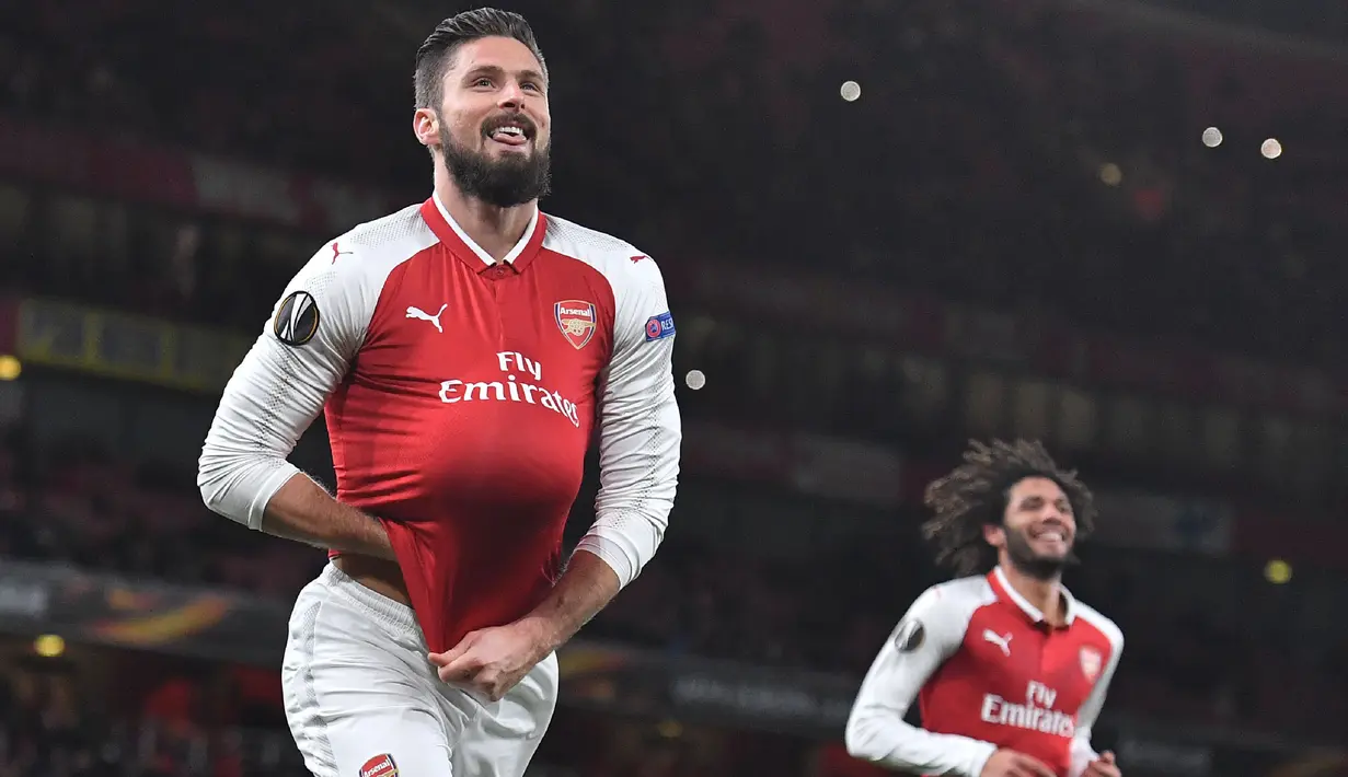 Olivier Giroud – Giroud merupakan striker yang memiliki finishing yang brilian. Selama berseragam Arsenal Giroud berhasil mengemas 69 gol dan 27 assists dalam 164 laga. (AFP/Ben Stansall)