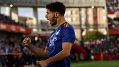 Penyerang Real Madrid Marco Asensio merayakan gol yang dicetaknya ke gawang Granada dalam laga lanjutan Liga Spanyol di Stadion Nuevo Los Carmenes, Senin (22/11/2021) dini hari WIB.  Real Madrid menang telak dengan skor 4-1 atas tuan rumah Granada. (AP Photo/Fermin Rodriguez)