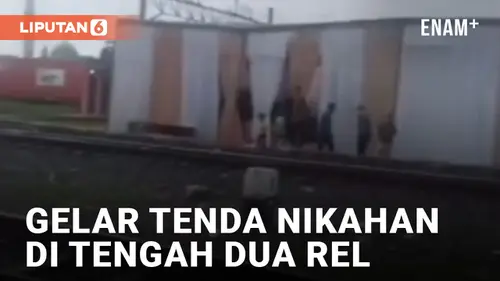 VIDEO: Viral, Warga Dirikan Tenda Hajatan di Tengah Dua Rel Kereta Api di Tanjung Priok