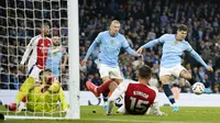 Gol Manchester City dicetak oleh Erling Haaland dan John Stones. Sementara itu gol Arsenal dipersembahkan Riccardo Calafiori dan Gabriel Magalhaes. (AP Photo/Dave Thompson)
