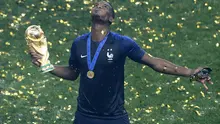 Paul Pogba merayakan kesuksesan menjadi juara Piala Dunia 2018. (AP/Frank Augstein)