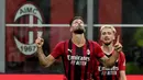 AC Milan berhasil menang telak atas tamunya Cagliari pada pekan kedua Liga Italia musim 2021/2022. Dua gol kemenangan Rossoneri dicetak oleh rekrutan anyar mereka pada musim ini, Olivier Giroud. (Foto: AP/Luca Bruno)