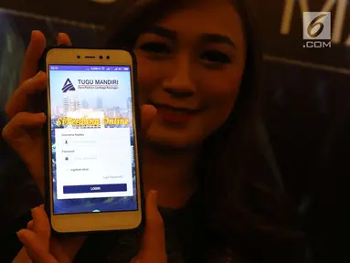 Model menunjukan aplikasi mobile SIPerdana usai di luncurkan di Jakarta, Rabu (28/3). Aplikasi ini merupakan sebagai satu-satunya system layanan informasi berbasis web di industry Dana Pensiun Indonesia. (Liputan6.com/Angga Yuniar)