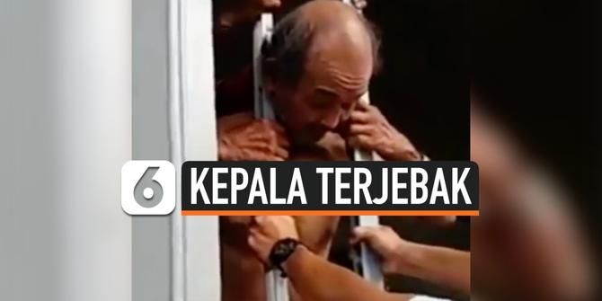 VIDEO: Kepala Pria Paruh Baya Terjebak di Teralis