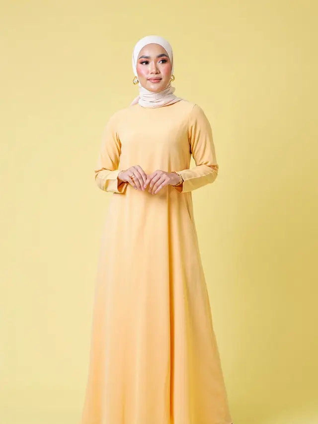 Warna jilbab yang cocok dipadukan dengan gamis butter yellow (Foto: Reve Art AI)
