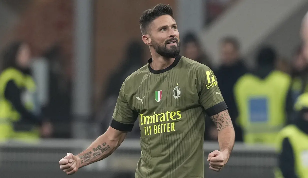 <p>Penyerang AC Milan Prancis Olivier Giroud berselebrasi setelah membuka skor saat menjamu Torino dalam duel pekan ke-22 Serie A 2022-2023, Sabtu (11/2/2023) dini hari WIB. AC Milan mengakhiri keterpurukannya di Liga Italia Serie A 2022/2023. (AP Photo/Antonio Calanni)</p>