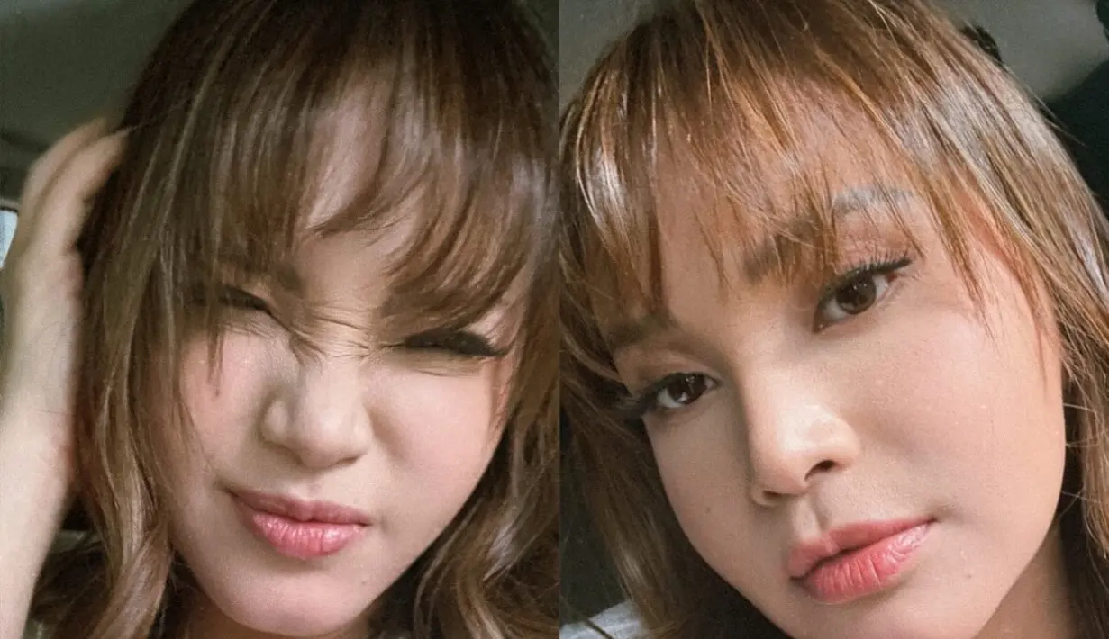 Ia pun tampil santai mengenakan t shirt putih lengan pendek yang memiliki tulisan di bagian depan.  [@itsrossa910]