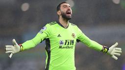 Selebrasi kiper Wolverhampton Wanderers, Rui Patricio saat menghadapi Arsenal pada laga Liga Inggris 2020/2021 di Molineux Stadium, Wolverhampton (2/2/2021). Rui Patricio mulai membela Sporting Lisbon sejak dipromosikan dari Sporting U-19 pada awal musim 2006/2007. Setelah 12 musim, pada awal musim 2018/2019 ia memutuskan hirah ke Premier League untuk membela Wolverhampton dan bertahan selama 3 musim hingga 2020/2021. (AFP/Shaun Botterill)