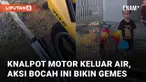 Ada-ada saja yang dilakukan bocah ini ketika bermain air dan memasukkan air ke dalam lubang knalpot.