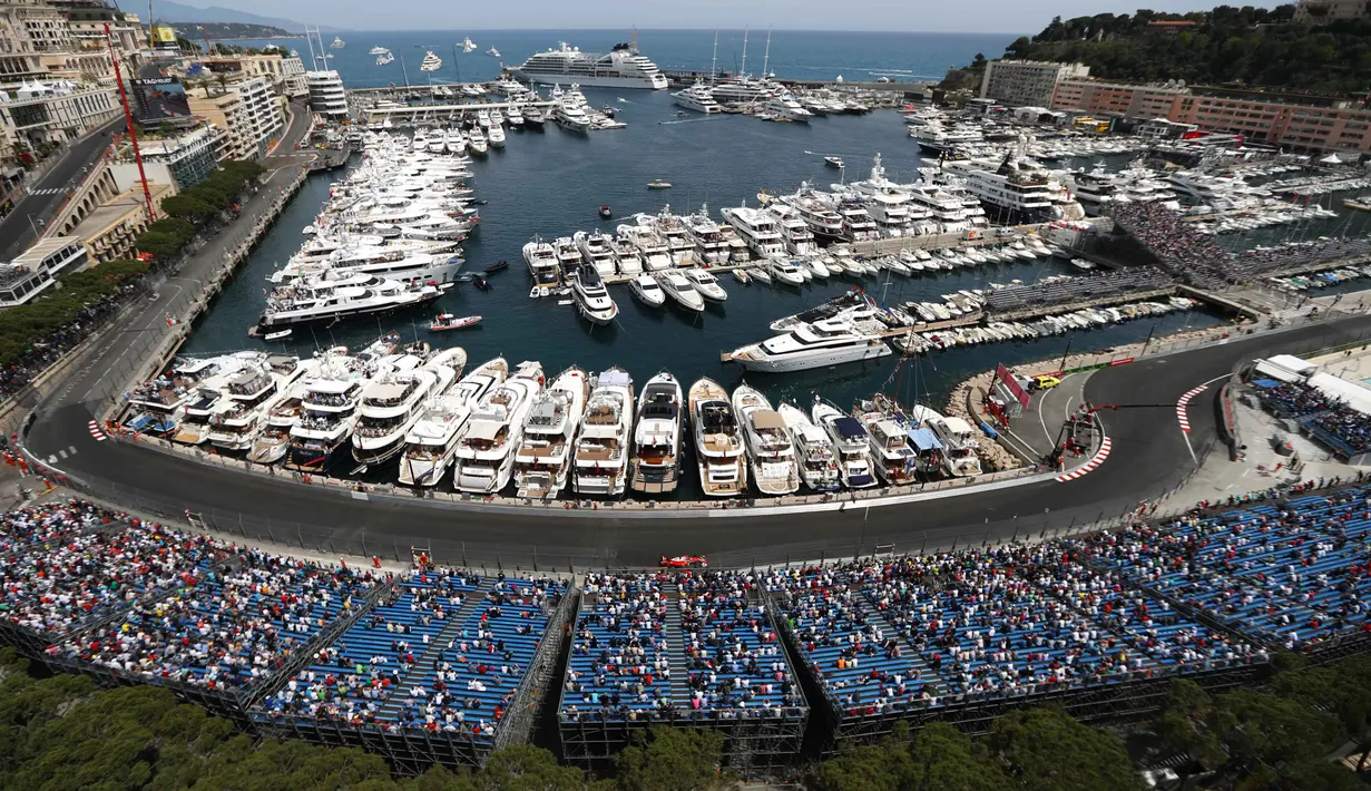 <p>Pemandangan indah Monako berpadu dengan balapan F1 saat digelar F1 GP Monako, (26/5/2016). (AFP/Valery Hache)</p>