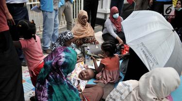 Puluhan Imigran Terlantar di Trotoar Jalan Kebon Sirih