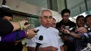 Bupati Kutai Timur Isran Noor usai menjalani pemeriksaan di Gedung KPK, Jakarta, Senin (22/12/2014). (Liputan6.com/Miftahul Hayat)